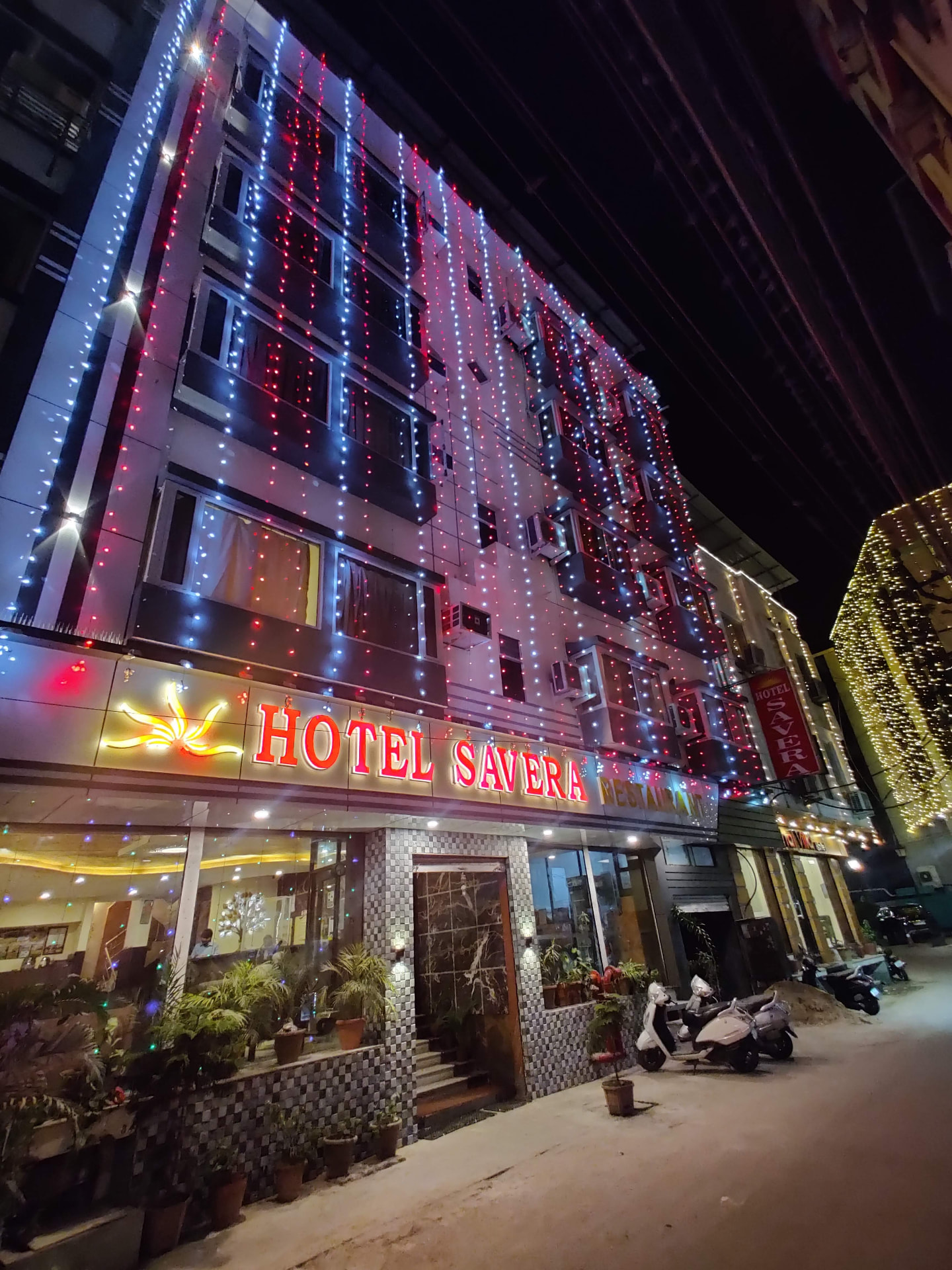 Hotel Savera Udaipur facade illuminated at night